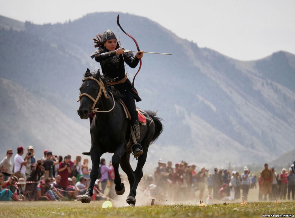 Turkey's Janset Genel in full flight during the mounted archery event, which the 18-year-old would go on to win, at the third World Nomad Games in Cholpon-Ata, Kyrgyzstan. (RFE/RL/Amos Chapple)